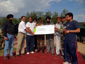 Dignitaries presenting prize to player at Poonch on Thursday.