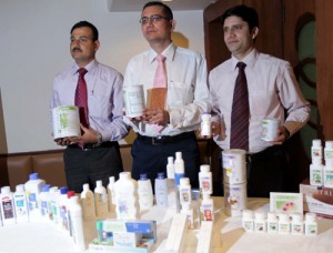 Representatives of Amway India displaying the products of the company at a press conference at Jammu on Thursday.		—Excelsior/Rakesh