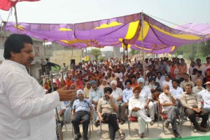 Minister for Relief and Rehabilitation Raman Bhalla addressing public gathering on Sunday.
