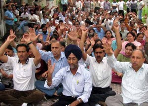 Govt employees sitting on protest dharna at Agriculture complex, Talab Tillo in Jammu on Wednesday. 	-Excelsior/Rakesh