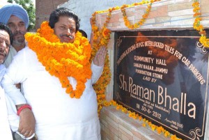 Minister for Revenue, Relief & Rehabilitation Raman Bhalla laying foundation stone of  development work at Sanjay Nagar on Monday.