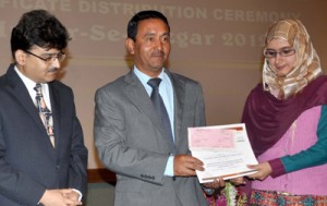 Minister for Tourism and Culture, Nawang Rigzin Jora, distributes certificates among the students at Srinagar on Thursday.