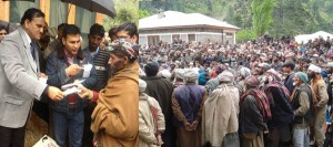 MLA Inderwal G M Saroori distributing IAY cheques among people during rally at Chhatrooni Kishtwar on Monday.