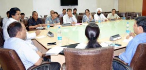 Minister for Revenue, Raman Bhalla interacting with officers during a meeting on Monday.