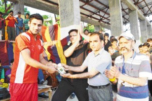 Sunny Malik  of HPCC Jammu receiving man of the match award for his 5-wicket haul at  Sports Stadium Doda on Thursday.