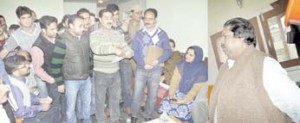 Minister for Revenue, Raman Bhalla interacting with migrant employees at Mattan Transit Camp on Thursday.