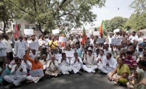 Panchs and sarpanchs protesting in Jammu on Tuesday.	