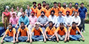 Players of J&K Tug of War team posing for a group photograph alongwith officials before leaving for Punjab.