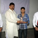 MLA Jugal Kishore felicitating a student after inaugurating Career Counseling Cum Guidance Programme at Jagti on Sunday.