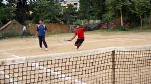 Players displaying skill during a match of Gulrez Memorial Tennis Tournament in Jammu on Tuesday.