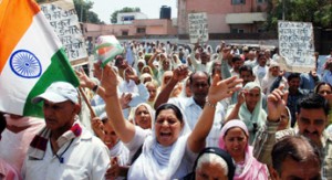 Shouting slogans against Govt, PoK refugees taking out protest rally in Jammu  on Tuesday. 	-Excelsior/ Rakesh