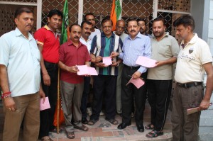 BJP leaders during a membership drive of the party in Gandhi Nagar on Friday.