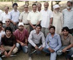 Visual artists alongwith officials posing for a photographs at five-day Sculptors and Painters Camp at Jammu on Wednesday.