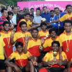 Karnataka team that won the All India Postal Football Tournament after defeating Kerala 1-0 pose for a photograph with the Finance Minister, Abdul Rahim Rather and Minister for Sports, R S Chib at Bakshi Stadium in Srinagar on Wednesday.