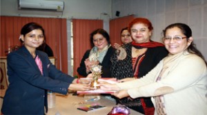 Dignitaries presenting trophy to winner of Inter-College Symposium at MIER in Jammu.