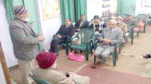 Dignitary expressing his views during a meeting to commemorate death anniversary of martyrs at Jammu on Friday.