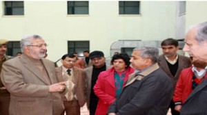 Minister for Medical Education, Taj Mohi-ud-Din interacting with officers during visit to Super Specialty Hospital at Jammu on Friday.