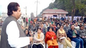 Minister for Housing, Raman Bhalla addressing public gathering at Jammu on Wednesday.