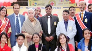 Divisional Commissioner Shantmanu alongwith winners posing for a photograph at Jammu on Monday.