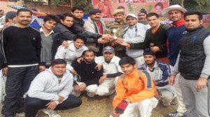 Jubilant players of Hind National CC posing for a group photograph alongwith the dignitaries in Jammu on Friday.