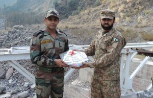 Indo-Pak Army officers exchange sweets at Aman Setu in Uri sector on Tuesday.