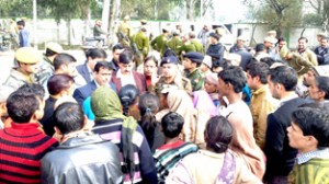 ADC Udhampur and Police officers trying to pacify the agitators at Satyani on Thursday.