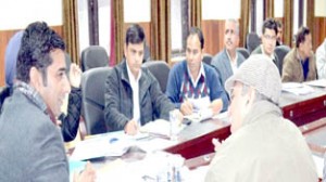 Deputy Commissioner Dr Shahid Iqbal Choudhary chairing a meeting at Reasi on Tuesday.