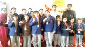 Winners of Quiz Competition posing for a photograph at Minerva School of Learning in Jammu on Saturday.