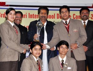 Minister for Housing Raman Bhalla presenting trophy to winners of 3rd Matushri Inter-School contest at Jammu on Saturday.