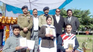 Winners of debate competition posing for group photograph with dignitaries on Wednesday.