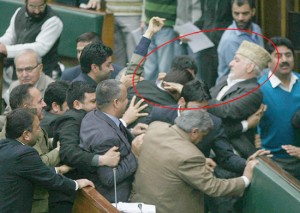 PDP MLA Syed Bashir catches hold of a Marshal before slapping him in the Assembly on Wednesday. -Excelsior/Rakesh