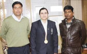 Ace sportspersons Khalida Banoo and Rashid Ah Choudhary of JKP posing alongwith SM Sahai, (ADGP) Armed.