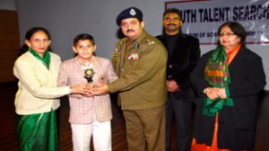 DIG Jammu Shakeel Beig felicitating winner during 13th Annual Prize Distribution Function organized by YTSF on Wednesday.