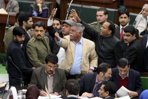 Opposition MLAs protesting in the Assembly over delay in release of water in canals on Sunday. -Excelsior/Rakesh