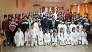 Karatekas posing for a photograph during Belt Grading Test at GD Goenka Public School in Jammu on Friday.