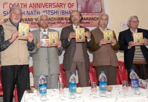 Eminent poet and physician, Dr KL Chaudhary and other dignitaries releasing souvenir on the noted Shaiva scholar V N Jotshi in Jammu on Sunday.        -Excelsior/ Rakesh