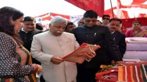 Minister for Planning Ajay Sadhotra inspecting a stall during Employment Fair at Jammu on Sunday.