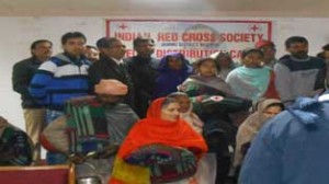 Beneficiaries of Relief Distribution Camp posing for photograph at Jammu on Tuesday.