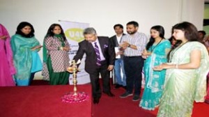 Dignitaries lightning lamp to inaugurate debate competition at Calliope College of Education.