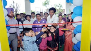 Dignitaries alongwith children inagurating Peepal Tree School at Lower Roop Nagar on Monday.