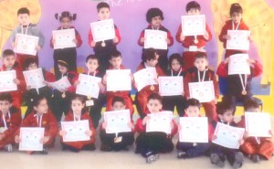 Karatekas of DRS Kids Bantalab holding certificates while posing for a group photograph after passing the test on Wednesday.