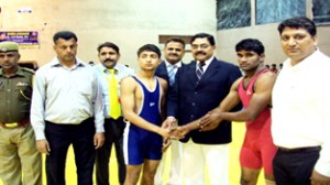 Vijay Singh Sambyal, Vijay Kumar and Dushyant Sharma inaugurating State Wrestling Championship in Jammu.