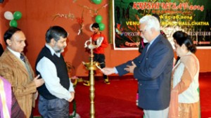 Chief guest and other dignitaries lighting the traditional lamp while inaugurating Krishi Utsav 2014 at SKUAST-Jammu.