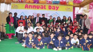 Children posing alongwith the dignitaries during Annual Function and Graduation Day at Little Millennium School in Jammu.
