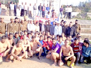 Participants of wrestling competition posing for photograph at Pouni, district Reasi on Saturday.