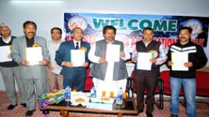 Raman Bhalla, Minister for Housing and Sports releasing the Calendar of Activities of the Mountaineering Association alongwith other dignitaries at Abhinav Theatre in Jammu.
