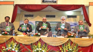 JU VC Prof MPS Ishar, Ex-VC Y R Malhotra and others releasing abstract book at a seminar during inaugural function on Thursday.