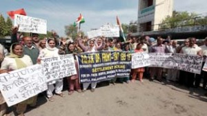 PoJK refugees protesting in front of Jammu Press Club on Tuesday.    -Excelsior/ Rakesh