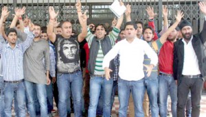 Scholars and students raising slogans during protest at Jammu University on Thursday.