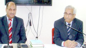 Justice B L Bhat and Director Judicial Academy Suresh Sharma during a training programme.